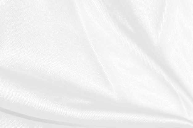 Smooth elegant white silk or satin luxury cloth texture can use as wedding background Luxurious background design