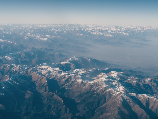 Smooth outline of the alps from above alpine mountain system stretches to the horizon line the