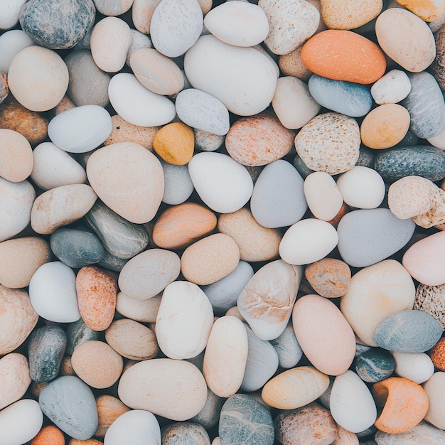 Photo smooth white grey and brown pebble stones background texture