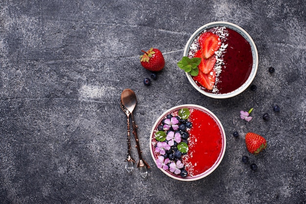 Smoothie bowls with strawberry and blueberry 