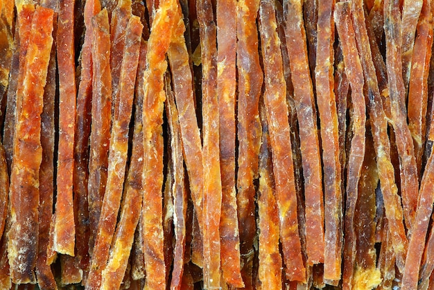 Snack to beer, sticks of fish meat. Macro detail background.