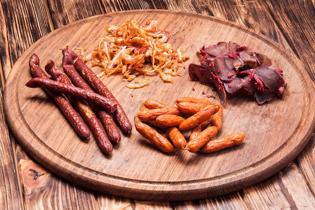 Snacks for beer - pork ears, sausages and basturma