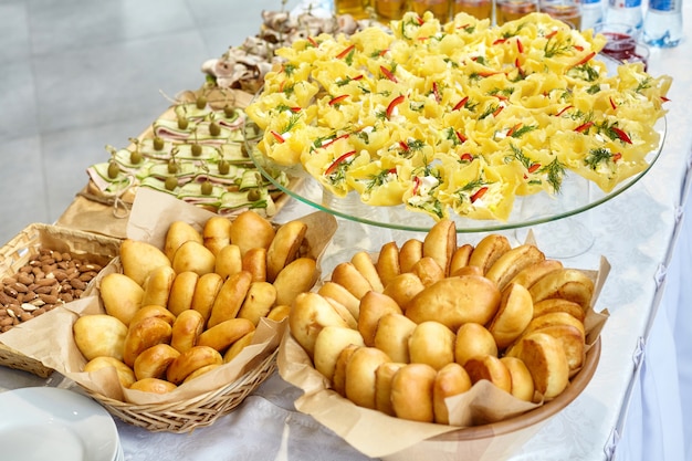 Snacks, canapes and patties on table