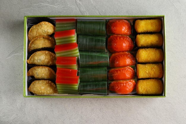 snacks jajan pasar from Indonesia pastel kue lapis beras lemper kue ku risoles served in box