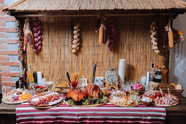 Snacks at the wedding cheese sausage vegetables meat products Cossack table at the Ukrainian wedding