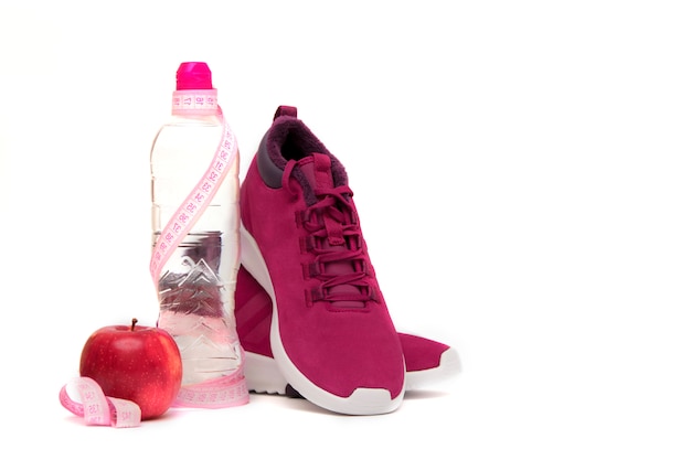  Sneakers, water and fruit on white. 