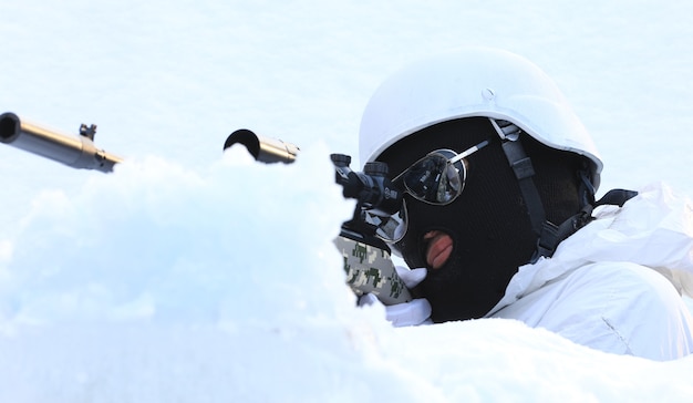 sniper with a gun in winter