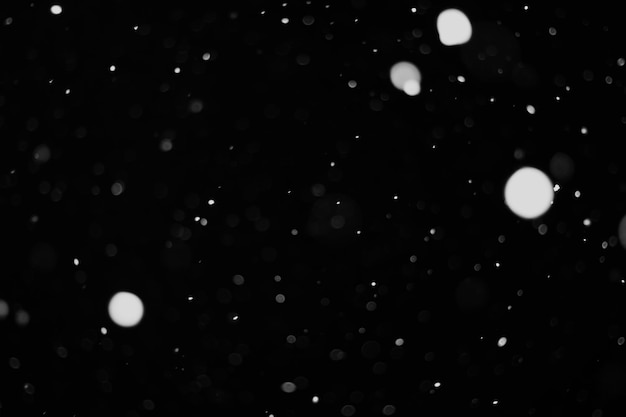 Photo snow background snow on a black background snowflakes for overlay