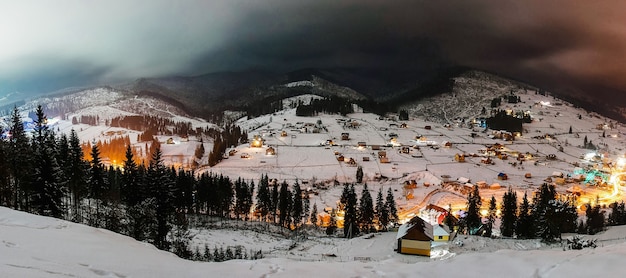 Snow-capped houses in mountains Carpathians Ukraine