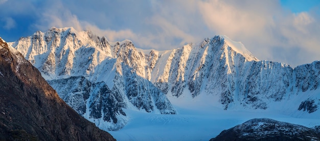 Snow capped mountain peaks in the morning light