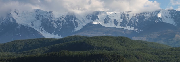 Snow capped peaks in cloudy weather