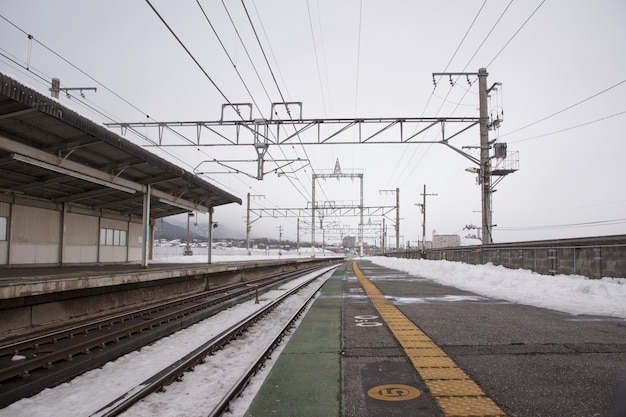 Snow-capped train station in winter