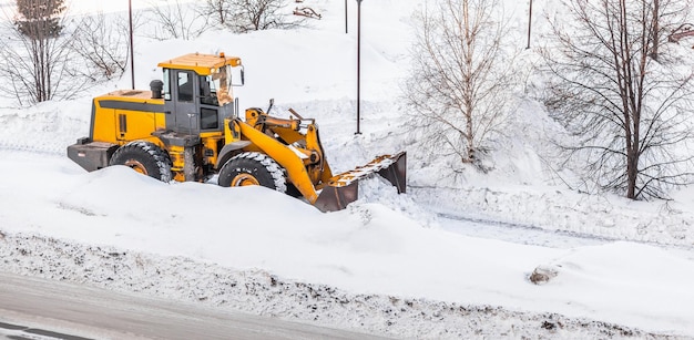 Snow clearing Tractor clears the way after heavy snowfall