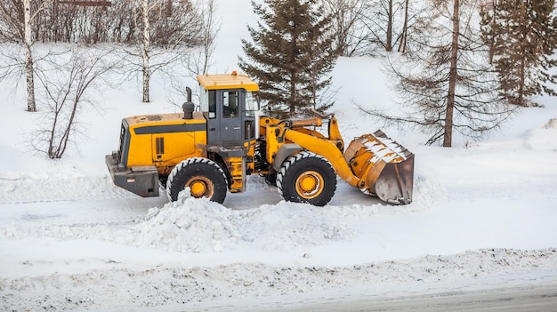 Snow clearing Tractor clears the way after heavy snowfall