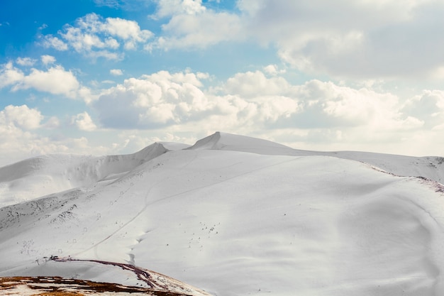 Snow covered beautiful mountain peaks with blue sky