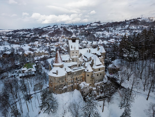 The snow covered medieval Castle of Bran known for the castle of Dracula Transylvania Romania