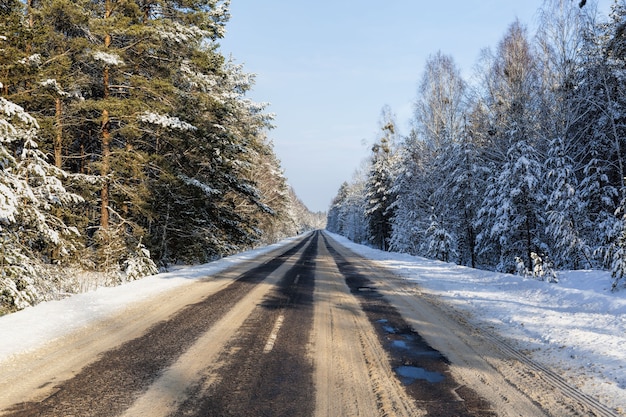 Snow covered winter road for car traffic