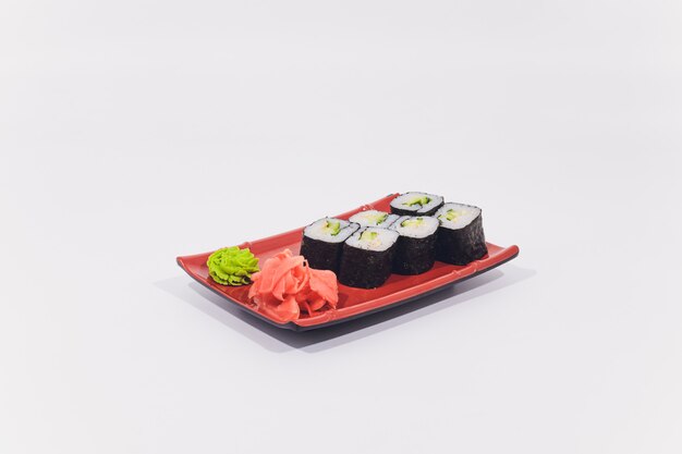 Snow crab, salmon, cream cheese and cucumber rolls isolated