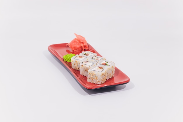 Snow crab, salmon, cream cheese and cucumber rolls isolated