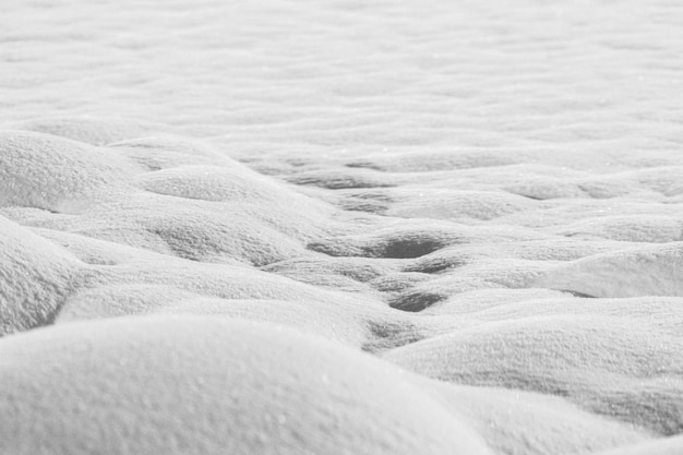 Snow drifts are isolated on a white background in shades of gray