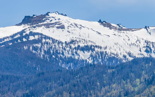 Snow melts on the mountain peaks, sunny spring day	