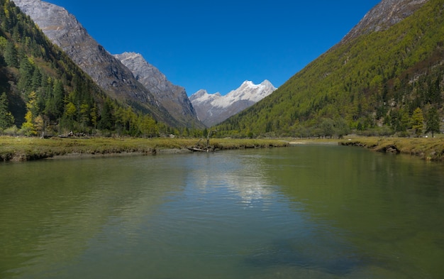 Snow mountain "Four Girls Mountain" Snow Mountains with lake on high attitude