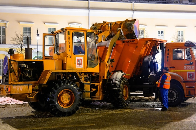 Snow removal on city streets Snowplow snowdrifts in a snowfall