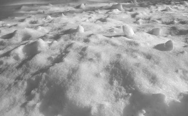 Snow texture snowdrifts under sunlight with shadows