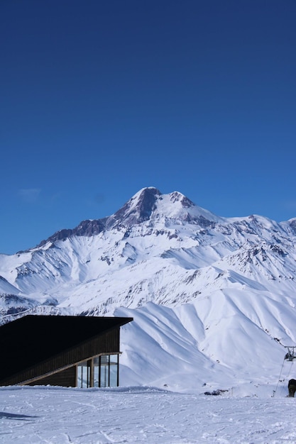 snowboarder flying on his board with cloud on background