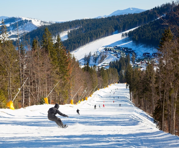 Snowborder on a piste