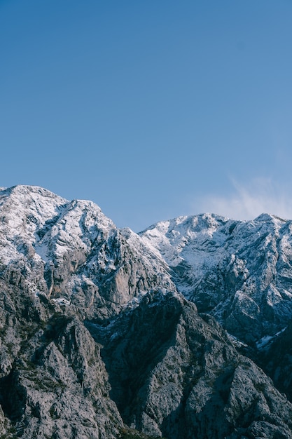 Snowcapped mountain peaks in boka kotorska winter in montenegro in kotor bay