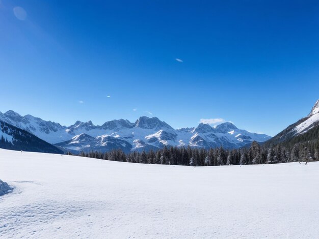 Photo snowcovered alpine meadow with a clear blue sky and distant mountains