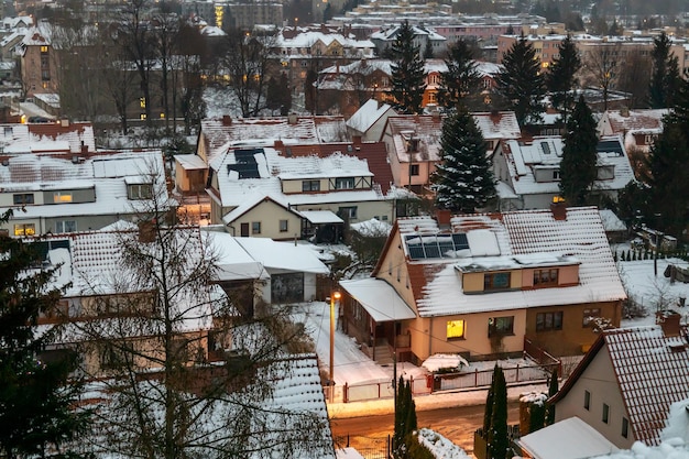 Snowcovered town at night from above winter city