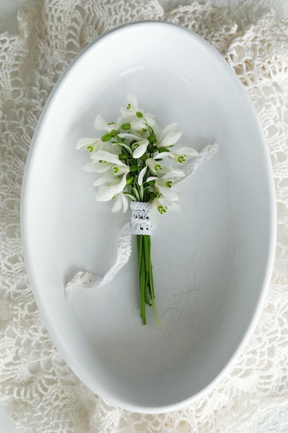 Snowdrops on a white plate