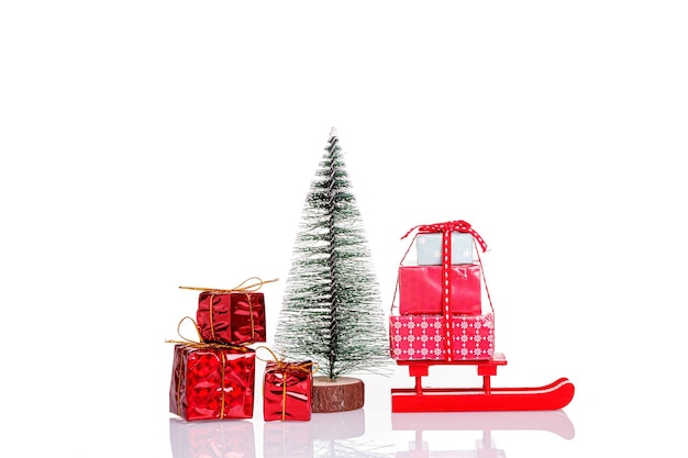 Snowman Christmas tree gifts sled on a white background