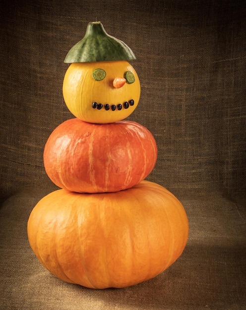 Snowman made of ripe pepper and bean pumpkins