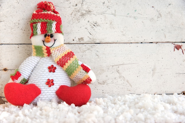 snowman sitting on snow