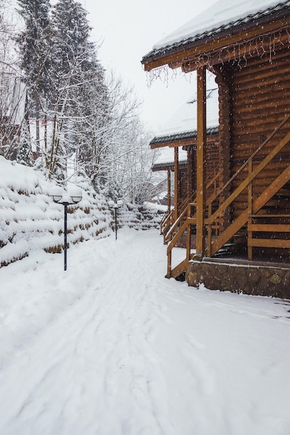 A snowstorm in the mountains sweeps up wooden house Wooden house