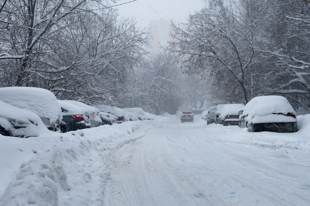 Snowy Moscow street after a heavy snowstorm in early winter morning