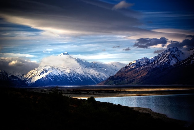 Snowy mountainous landscape of the New Zealand alps with dramatic skies during a motorhome trip