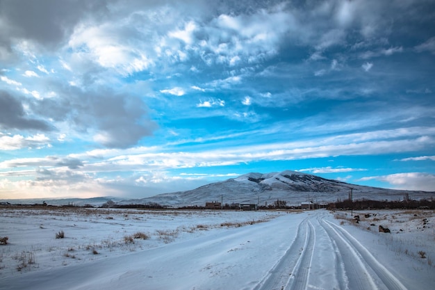 Snowy road with mountain