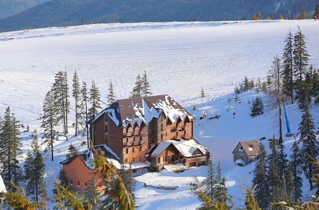 Snowy ski resort in mountains on winter day