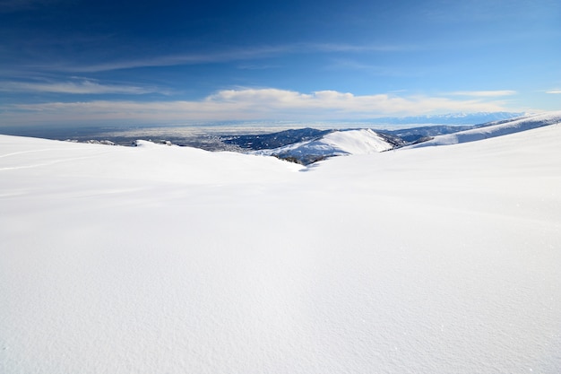 Snowy slope with superb panoramic view winter on the alps