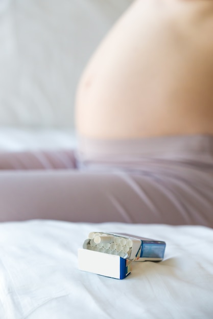 Snuff package with a pregnant woman background