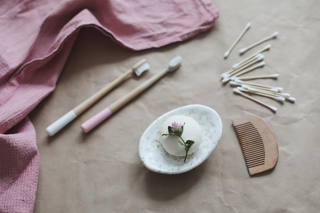 Soap bar bamboo toothbrush and towel top view Accessories for personal hygiene Plastic free and eco friendly products in household