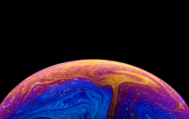 Photo soap bubble simulating the atmosphere of a planet with different shapes colors