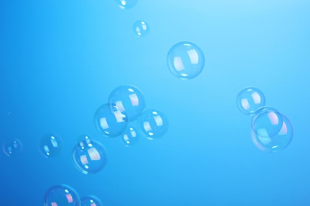 Soap bubbles on blue background