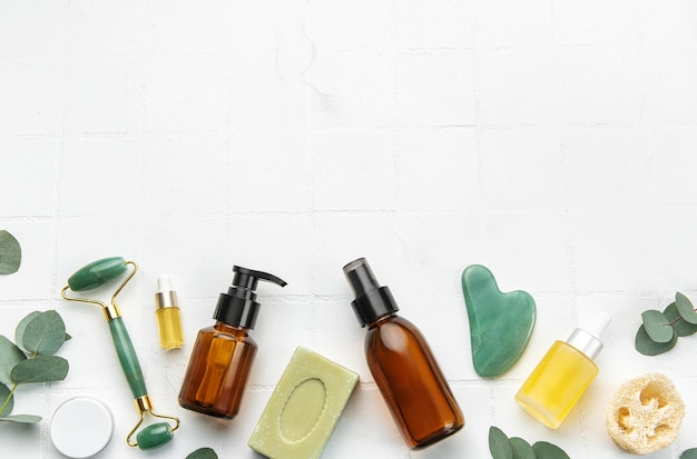 Soap eucalyptus aroma oil spa objects on white tile background