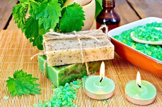 Soap homemade with nettles in mortar on board