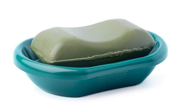 Soap on a plastic soap dish isolated on a white background